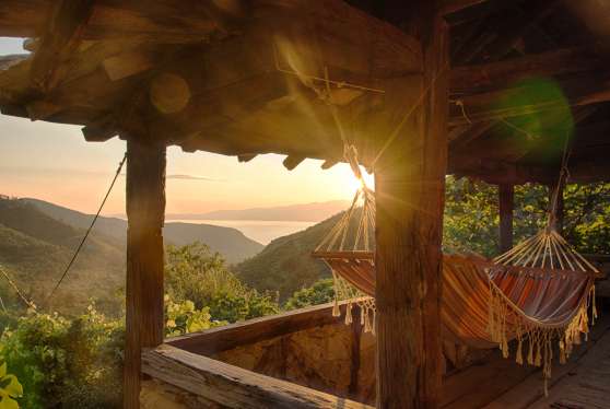Sea view at sunset from the loggia of the holiday home Karavousi